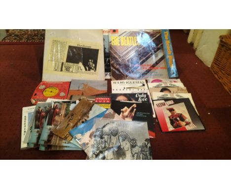 A collection of vinyl LPs and single records, primarily pop from the 1960s/70s, to include a bootleg copy 'The Story So Far' 
