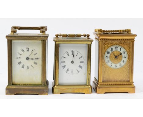 An early 20th century French brass carriage clock, having painted porcelain dial with Roman numerals and 8 day movement, toge