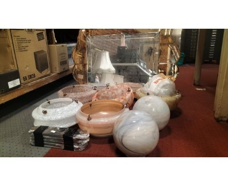 A collection of 1930s Art Deco glass ceiling light shades, together with glass globe lamp shades, an Art Deco wall mirror and