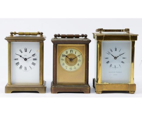An early 20th century French brass carriage clock, having painted porcelain dial with Arabic numerals and 8 day movement, tog