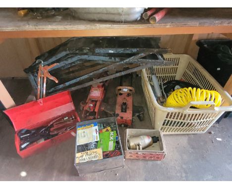 A pair of metal car ramps, 2 x trolley jacks, a box containing air lines, gas cutting nozzle along with various hand tools. (
