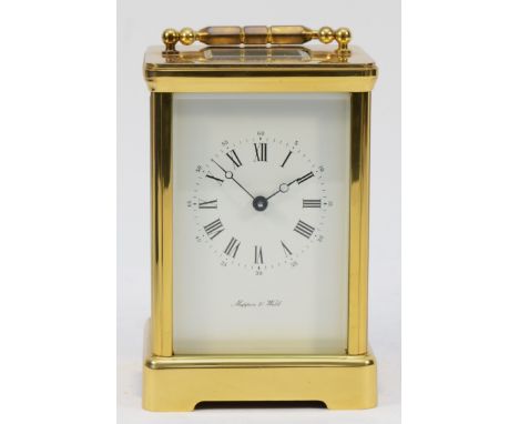 A 1980s English Mappin &amp; Webb brass carriage clock, the white enamelled dial with Roman numerals, having jewelled 8 day m