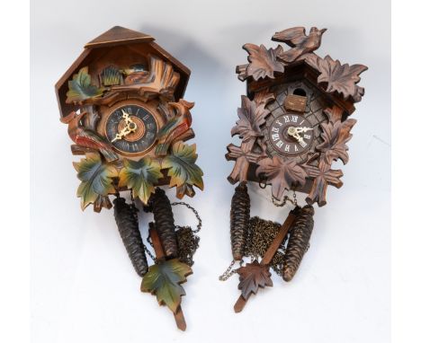 Two mid 20th century Black Forest cuckoo clocks, having twin train manual wind movements. (2) 