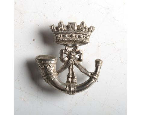 A Victorian white metal Duke of Cornwall's Volunteer Battalion cap badge with coronet above strung bugle, the reverse with th