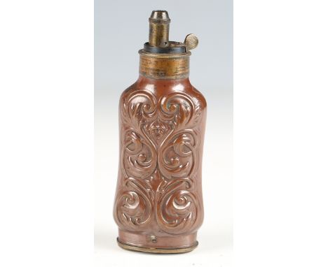 A fine, rare 19th century three-way pistol powder flask with shaped foliate embossed copper body and gilt brass nozzle, the b