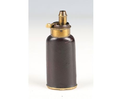 A fine early 19th century three-way pistol powder flask with leather covered body and gilt brass dispensing nozzle and base w