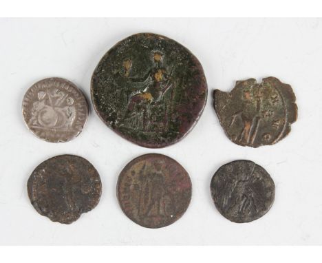 A small group of ancient Roman coinage, including a denarius of Augustus (27 BC to 4 AD), a sestertius of Sabina and a barbar