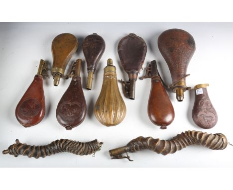 A small collection of 19th and 20th century powder and shot flasks, including two antelope horn powder flasks, a brass mounte