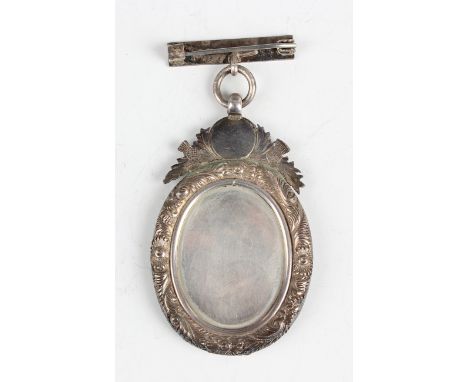 A Scottish silver oval medallion, detailed 'Sandyford Burns Club Instituted 1893', engraved with two dogs surmounted by a por