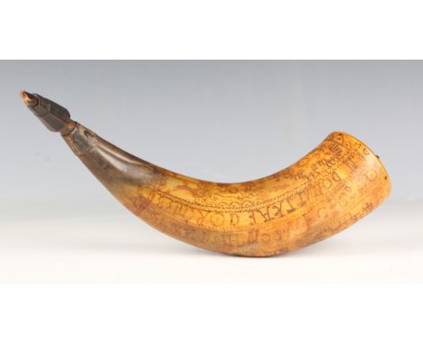 An early 19th century Continental engraved cow horn powder flask, the body decorated overall with lines of script, figures an