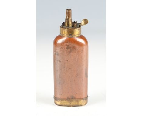 An early 19th century copper and brass three-way pistol powder flask, the base with double-pivoting lidded compartments for w