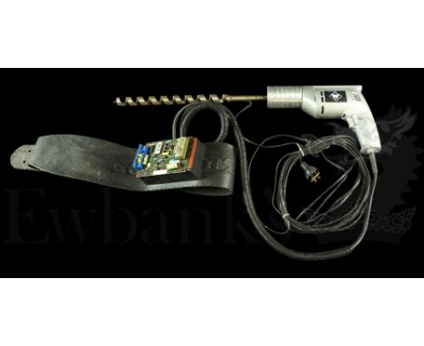 † Tank Girl (1995) A large electric Power Drill with long cork screw attachment made for the film. The Drill is attached via 