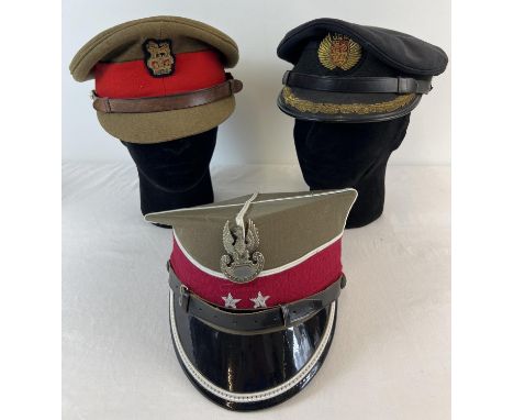 2 Military peaked caps. A Polish army "Rogotywka" cavalry officers cap and a British army officers cap with bullion cap badge