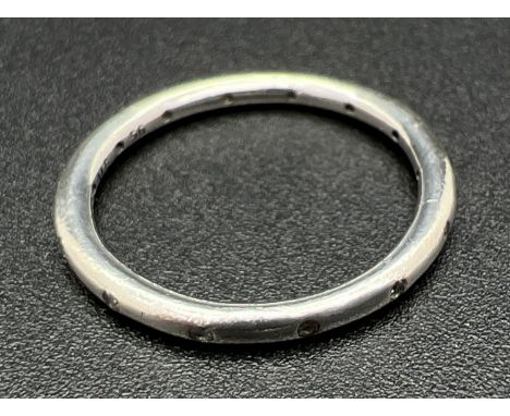 A boxed silver 'Simply Sparkling' band ring by Pandora. Marked inside of band S925 Ale 56. Size NÂ½ or 56. 