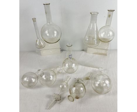 A collection of 10 assorted vintage glass scientific bottles, flasks and instruments. In varying sizes and styles. To include