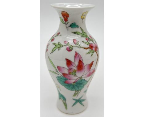 A small Chinese porcelain vase with flower and insect design and red seal mark to underside. Approx. 10.5cm tall. 