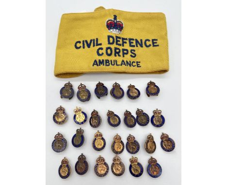 26 vintage enamelled metal Civil Defense Corps pin and lapel badges, to include WW2 together with a yellow cloth embroidered 