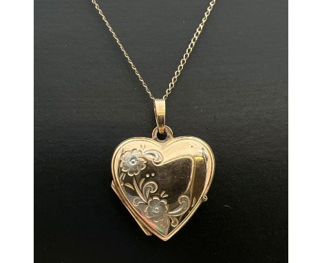 A 9ct gold heart shaped locket with floral detail to front, on an 18" fine belcher chain with spring ring clasp. Gold marks t
