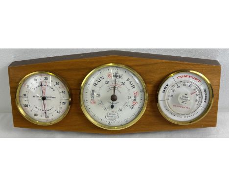 A vintage wooden mounted, wall hanging British Rototherm triple barometer. With gauge for temperature, humidity and one for b