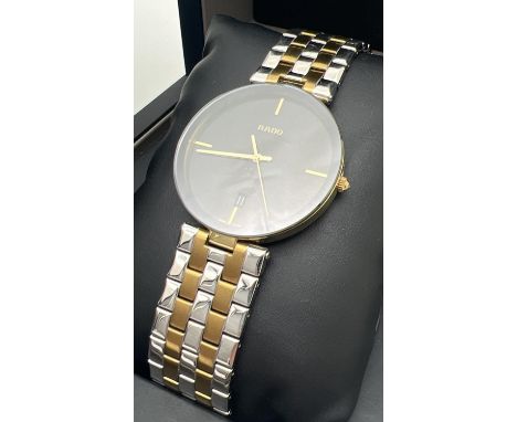 A boxed men's Rado Florence quartz wristwatch 15448866. Gold and silver tone stainless steel strap and case with edge to edge