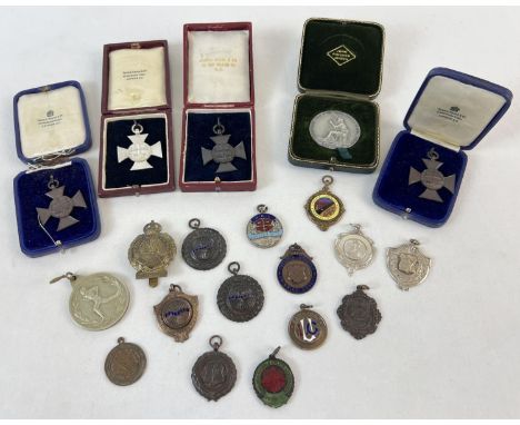 20 vintage boxed and unboxed sports medals and medallions. To include swimming, running, football and shooting. Dating from 1