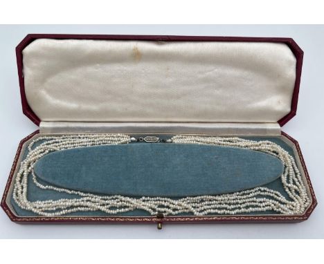 A vintage 17" 5 row seed pearl necklace with 18ct gold &amp; rose diamond fish hook style clasp. In original fitted box with 