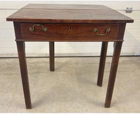 A small Georgian fold out tea table with single draw and pull-out gate leg support. Angled square legs and brass drop down dr