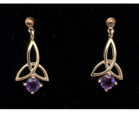 A pair of unmarked 9ct gold and amethyst drop earrings of Celtic design, complete with butterfly backs. 2.2cm drops set with 