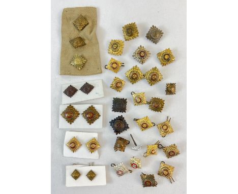 A small box of 35 Officer's brass and bronze shoulder pips, some with enamel detail. In various sizes. 