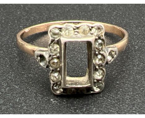 A vintage 9ct gold and silver dress ring. Square set mount with central stone missing, with 14 small round cut clear stones t