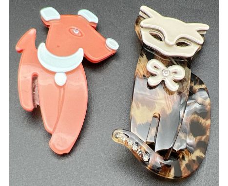 2 Lea Stein style Lucite animal brooches. An orange and pale blue coloured dog together with an animal print design cat set w