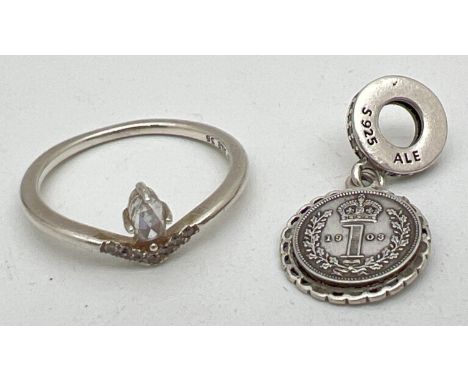 A silver Pandora ring and charm, both stamped 'S 925 ALE'. A clear stone set wishbone style ring with a oval cut stone (size 