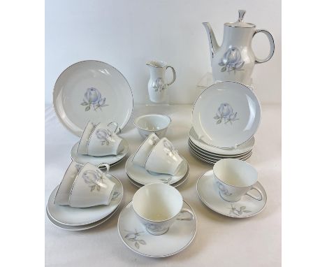 A vintage porcelain coffee set by Thomas Rosenthal in Blue Rose design with 24k white gold trim. Comprising: Coffee pot, crea