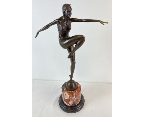 An Art Deco style bronze figurine of an exotic female dancer in Eastern attire. On a cylindrical shaped marble base. Approx. 