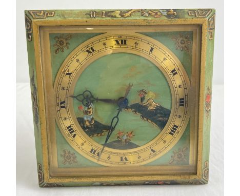 An early 20th century J Cameron of Kilmarnock bedside clock of Oriental design. Green ground with hand painted gilt floral an