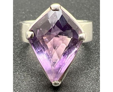 A 925 silver modern design wide band dress ring set with a large Kite cut amethyst. Stone approx. 2cm x 1.5cm. Ring size OÂ½.