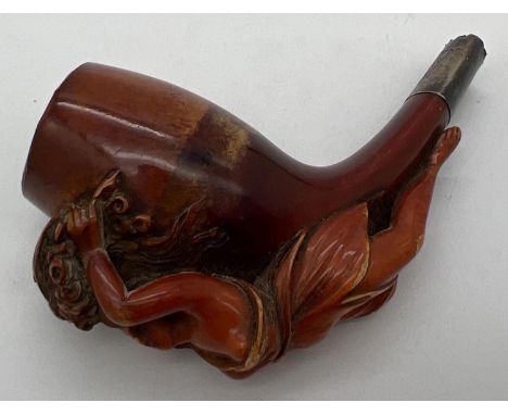 An antique Meerscham style pipe with carved figurehead of a woman holding a cornucopia of flowers. With white metal collar en