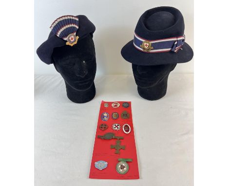 2 vintage felt red cross nurses hats with ribbons, one with enamel badge. Together with 13 metal and enamel nursing badges to