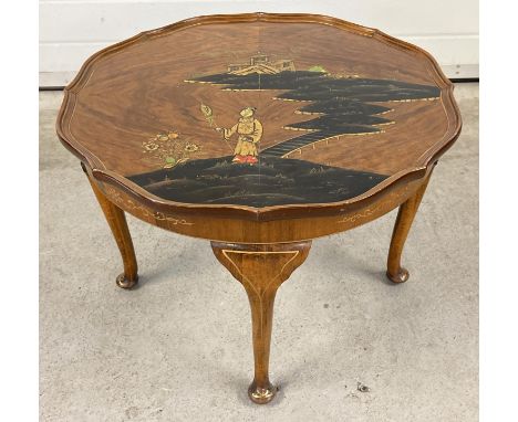 A vintage Northampton Cabinet company circular shaped coffee table with Chinoiserie decoration. 4 legged table raised on cabr