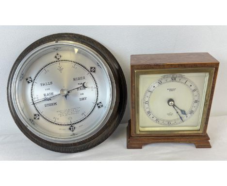 A vintage 1940's wooden cased 'Elliott' wind up mantle clock from W. R. Bullen of Norwich, in working order. Together with a 