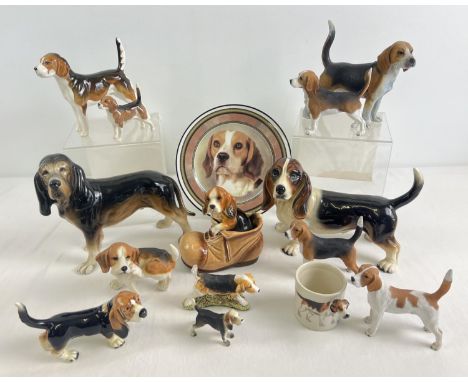 A collection of assorted ceramic &amp; resign ornaments of beagles and bassett hounds. To include Beswick, Goebel, Melba Ware