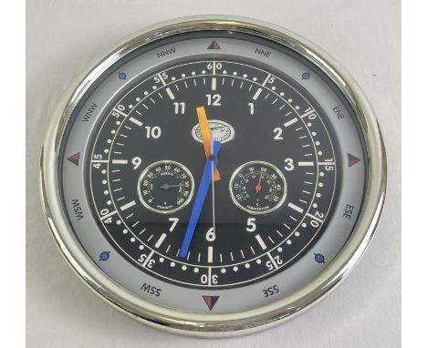 A modern Spirit of St. Louis battery operated wall clock with integral humidity &amp; temperature gauges. In working order, c