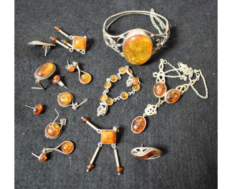 A silver bangle set with a polished amber oval cabochon; other silver and amber jewellery, earrings, necklace, bracelet; qty
