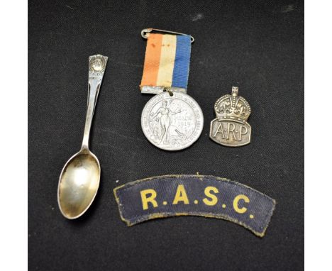 A silver ARP badge; a Derby peace medallion, 1919; a RASC patch