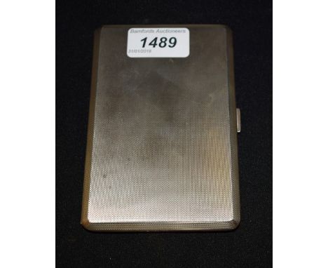 A silver cigarette case by Garrard and Company Ltd, machine turned, gilded interior, London 1956, approx. 236g