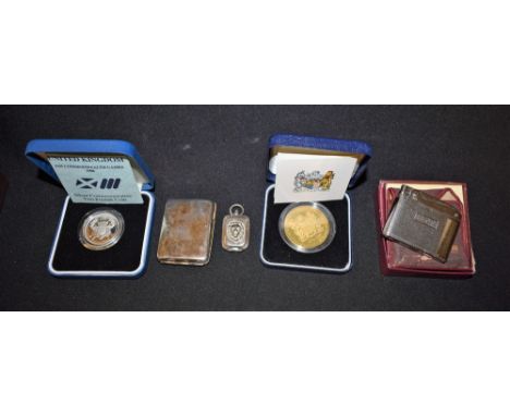 A Ronson cigarette lighter; a metal match case; a metal ink set; a silver £2 coin; etc.