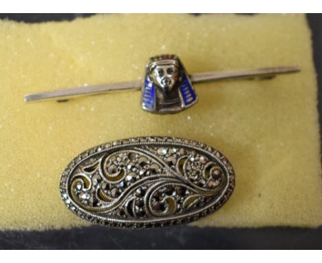 A Victorian Egyptian Revival enamel and silver brooch; a marcasite silver brooch