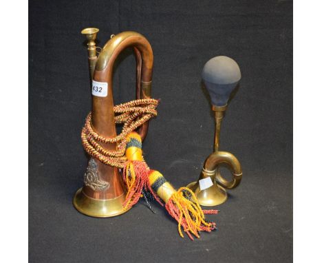 An early 20th century copper and brass bugle; a car bugle horn (2) 
