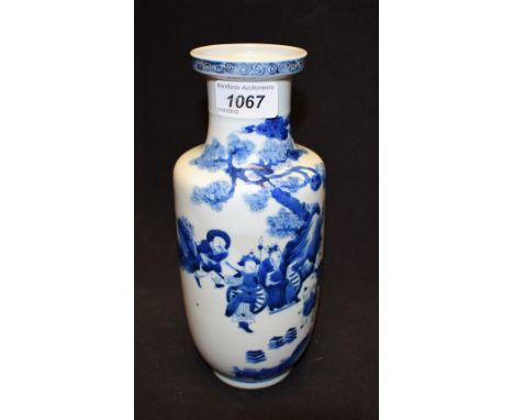 A Chinese cylindrical vase, decorated in underglaze blue with oriental figures and pine tree, 24cm high, six character Kangxi