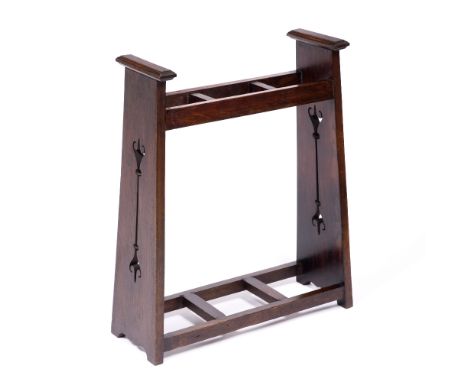 Attributed to Liberty & Co. Arts & Crafts oak stick stand, circa 1900 pierced sides, with three recesses  73cm high, 55cm wid